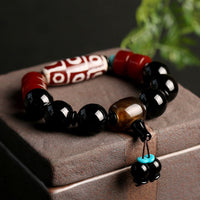KarmaRipple's Tibetan Nine-Eye Dzi Bead Black Onyx Wealth Protection Bracelet